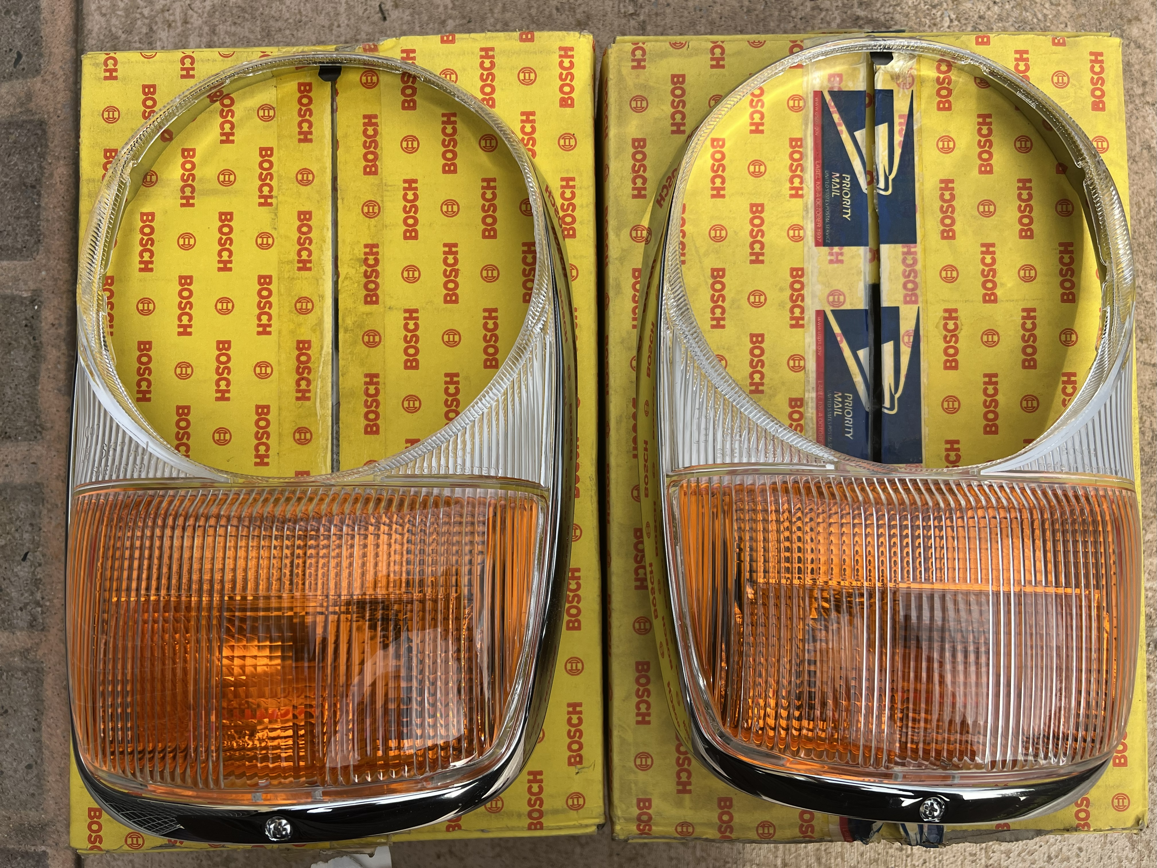 NOS BOSCH W113 North American Headlight Doors For Sale | The MB Market